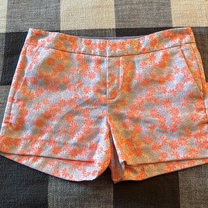 NWOT cute shorts with side pockets, blue-grey and orange flowers.